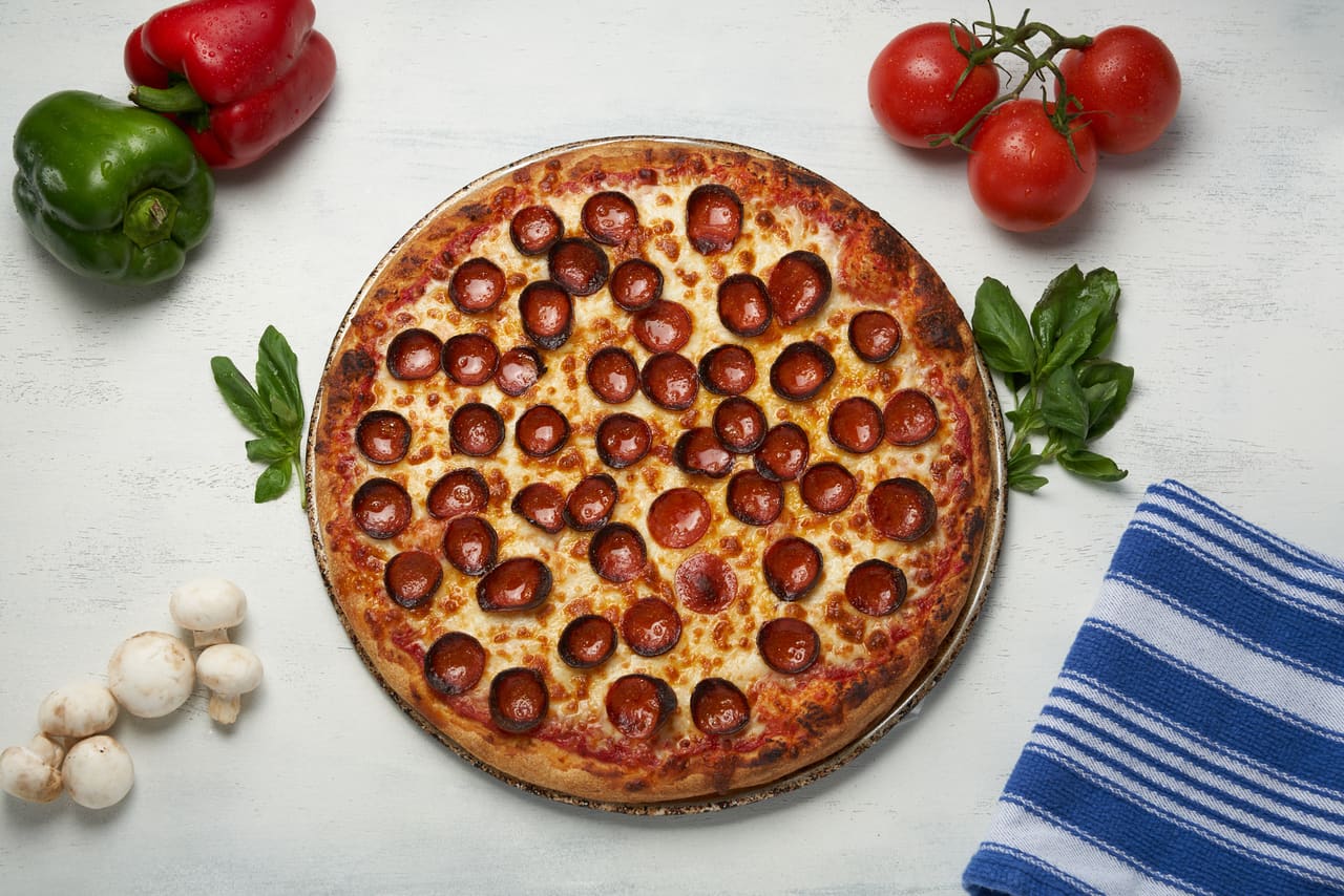 A whole pepperoni pizza fresh from the oven